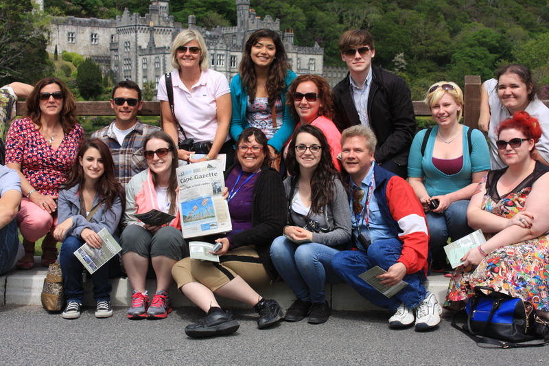 Stopping for a look at the Cape Gazette during a tour of Kylemore Abbey in Ireland are in back (l-r) instructor Tina Ballas Downs, Ryan Snyder, instructor/co-leader Kim Burton, Anette Aguillon, Christina Huck, Sal Klosiewicz, Rebecca Shirley and Tiffany Towles. In front are Samantha Bennett, Laura Gagnon, Anna-Marie Emmi, Maura Marraffini, Randy Miller, and Samantha Jamgochian. Not shown are instructor/group leader Heather Madden and Josh Gorrell. SOURCE SUBMITTED